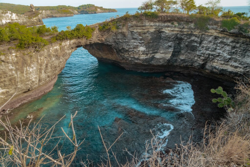 View of the cove entrance to Broken beach, with clear blue water