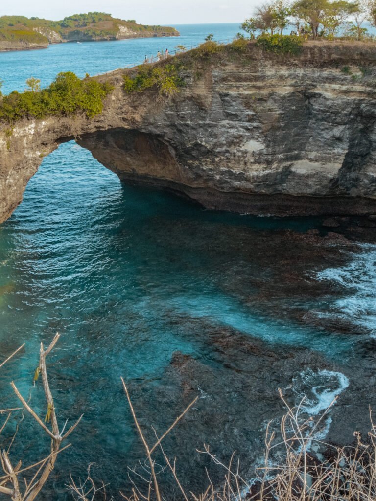 View of the cove entrance to Broken beach, with clear blue water